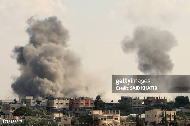 Smoke billows from the Gaza's Rafah border crossing with Egypt during an Israeli airstrike on October 10, 2023. Gaza's border crossing with Egypt,...