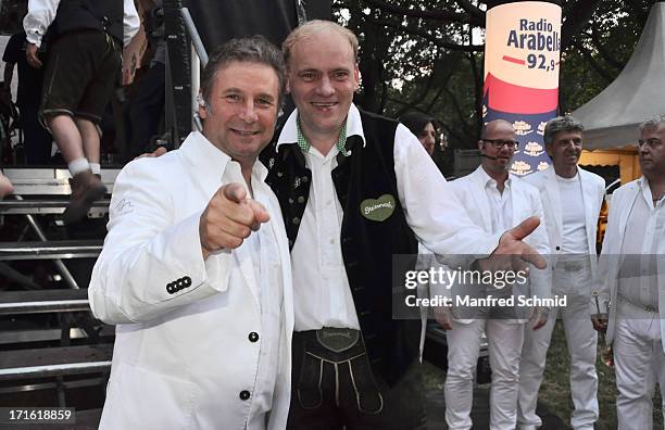 Gottfried Wuercher of Das Nockalm Quintett and Fritz Kristoferitsch of Die Edlseer pose backstage for a photograph during the 30th anniversary of...