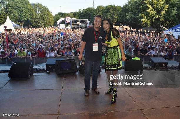 Joey Fellner and Antonia pose on stage during the 30th anniversary of Donauinselfest 2013 on June 23, 2013 in Vienna, Austria.