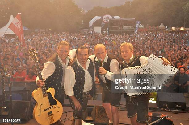 Manfred Maier, Luigi Neuwirth, Fritz Kristoferitsch and Andreas Doppelhofer of Die Edlseer pose on stage for a photograph during the 30th anniversary...