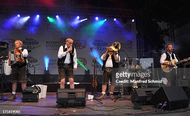 Andreas Doppelhofer, Fritz Kristoferitsch, Luigi Neuwirth and Manfred Maier of Die Edlseer perform on stage during the 30th anniversary of...
