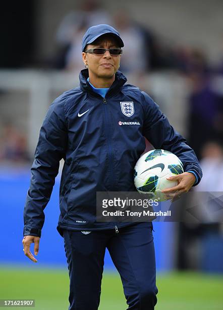 Hope Powell, manager of England looks on during the England Women v Japan Women - Womens' International Match at Pirelli Stadium on June 26, 2013 in...