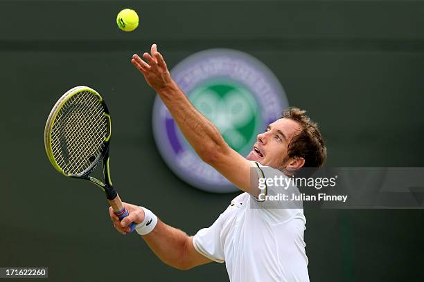 Richard Gasquet of France serves during his Gentlemen's Singles second round match against Go Soeda of Japan on day four of the Wimbledon Lawn Tennis...