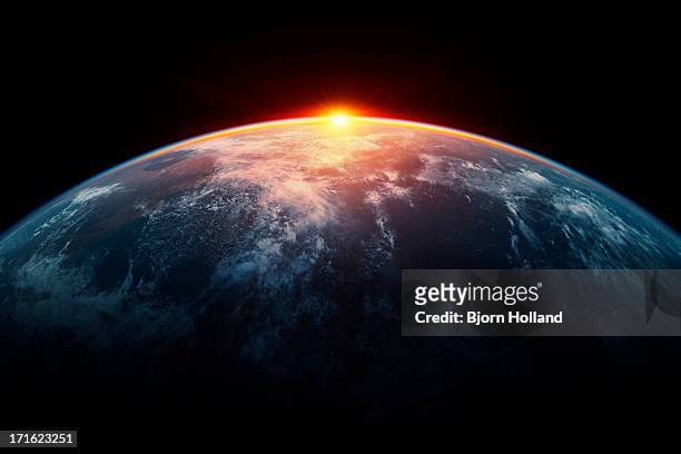 sunlight eclipsing planet earth - textfreiraum stock-fotos und bilder