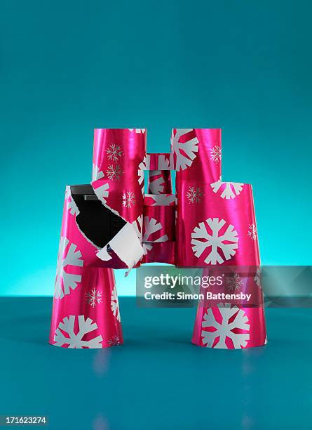 binoculars wrapped in christmas paper - torn gift stock pictures, royalty-free photos & images