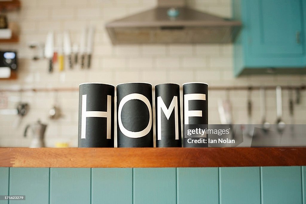 Word 'Home' on kitchen counter
