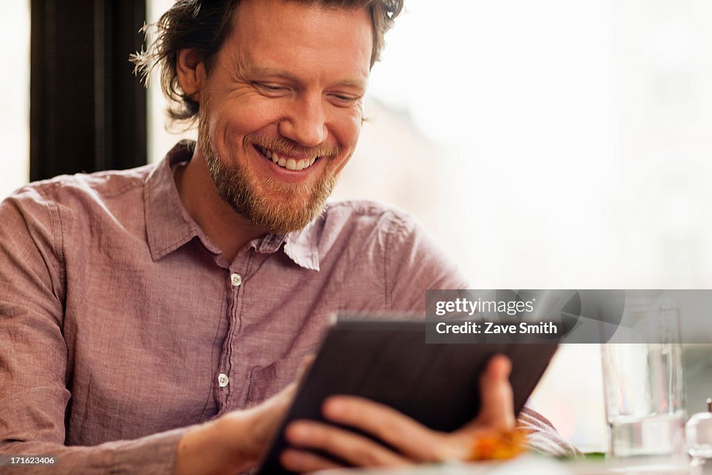 Man using digital tablet