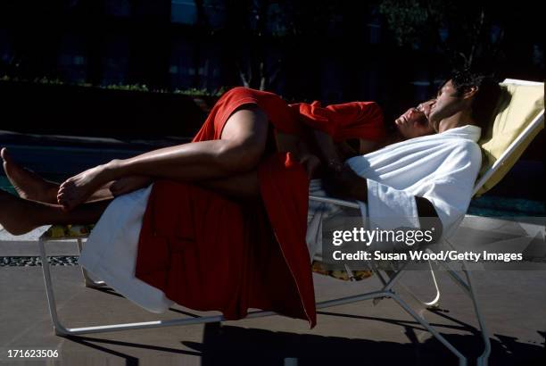 American model and actress Cheryl Tiegs and her husband, film director Stan Dragoti, relax together beside a pool at La Costa Resort & Spa, Carlsbad,...