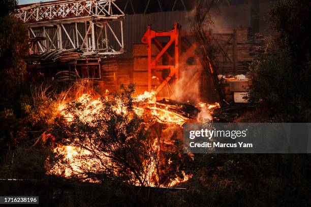 Fire breaks out outside an industrial facility after a rocket lands in the area, a few miles outside of Gaza, near Sderot, Israel, Monday, Oct. 9,...