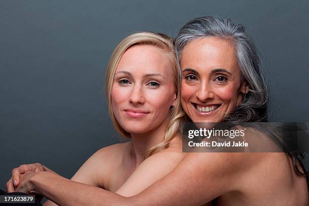 young woman and mature woman hugging - glendale california stock pictures, royalty-free photos & images