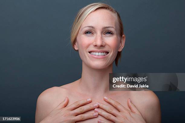 young woman touching chest - beautiful woman chest fotografías e imágenes de stock