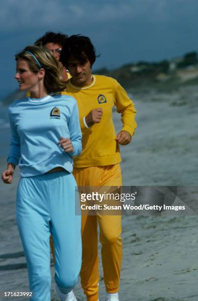 American model and actress Cheryl Tiegs jog on the beach with her husband, film director Stan Dragoti at La Costa Spa & Resort, Carlsbad, California,...
