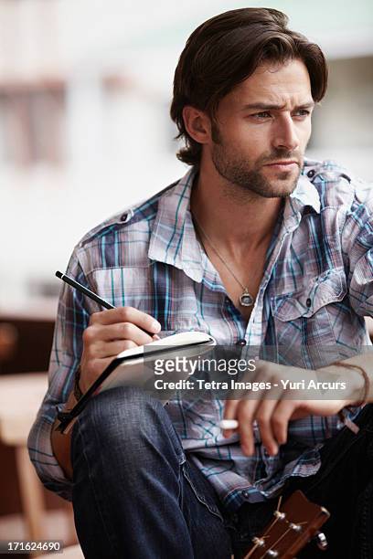south africa, cape town, man doing notes - poet stock pictures, royalty-free photos & images