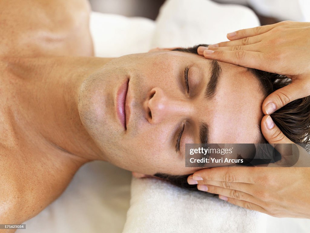 South Africa, Cape Town, Man receiving massage in spa