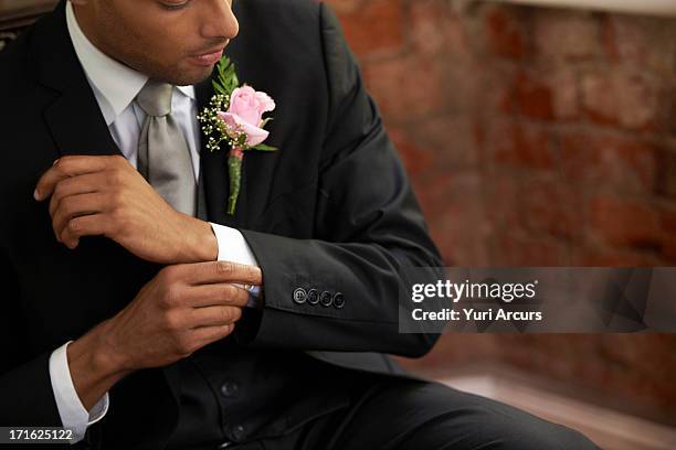 south africa, cape town, bridegroom adjusting cuff - boutonniere ストックフォトと画像