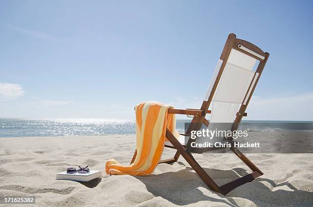 usa, massachusetts, nantucket island, sun chair on sandy beach - sun beach stock-fotos und bilder