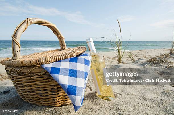 usa, massachusetts, nantucket, nantucket island, picnic basket and white wine on beach - wine basket stock pictures, royalty-free photos & images