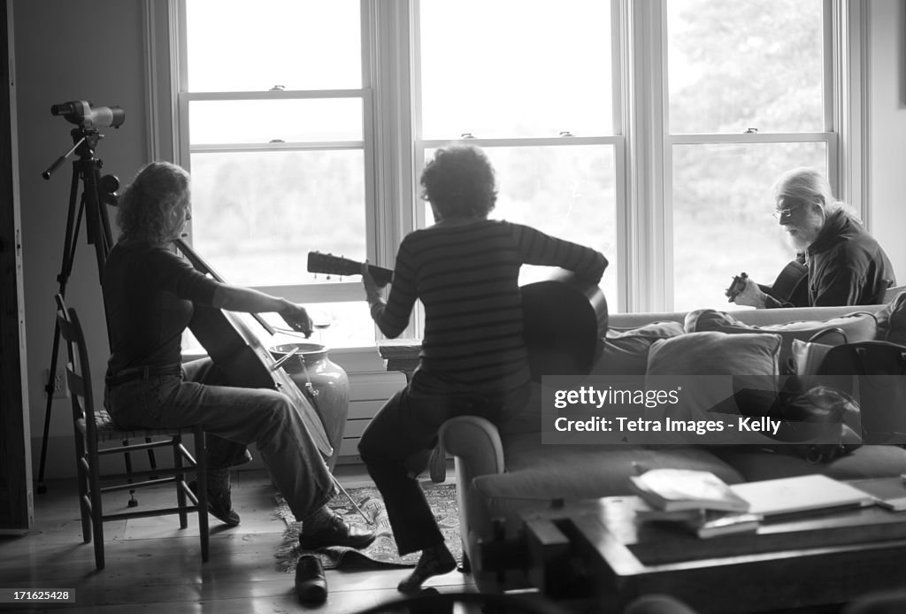 USA, New York, Three people playing together