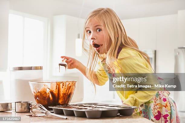 usa, utah, lehi, girl (6-7) baking cupcakes - lehi stock pictures, royalty-free photos & images