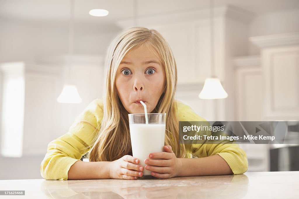 USA, Utah, Lehi, Blonde girl (6-7) drinking milk