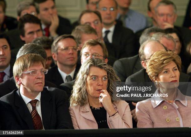 Belgium Prime Minister Guy Verhofstadt, his wife Dominique Verkinderen , and US First Lady Laura Bush listen as US President George W. Bush delivers...