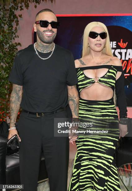 Nicky Jam and Ivy Queen at the Billboard Latin Conference at the Faena Forum on October 3, 2023 in Miami Beach, Florida.