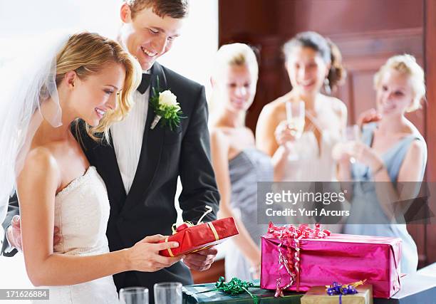 south africa, cape town, wedding couple opening gifts - wedding gift stock pictures, royalty-free photos & images
