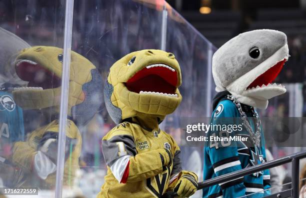 The Vegas Golden Knights mascot Chance the Golden Gila Monster jokes with a San Jose Sharks fan after the Sharks defeated the Golden Knights 2-0 in...