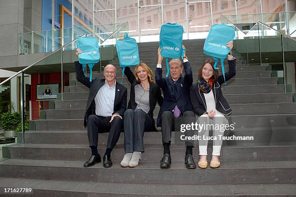 Dan Toole; Eva Padberg; Jurgen Heraeus and Sophie Lemmer attend 60 Years UNICEF Germany Press Conference at Federal Press Conference on June 27, 2013...