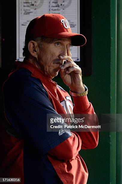 Manager Davey Johnson of the Washington Nationals reacts in the dugout while watching game two of a doubleheader against the Minnesota Twins at...