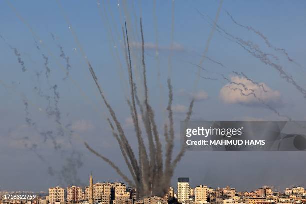 Salvo of rockets is fired by Palestinian militants from Gaza towards Israel on October 10, 2023. Israel said it recaptured Gaza border areas from...