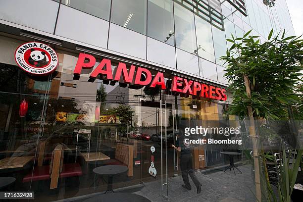An employee enters a Panda Express restaurant in Mexico City, Mexico, on Wednesday, June 26, 2013. Grupo Gigante SAB, the owner of Panda Express...