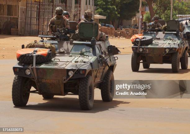 French troops, under escort from Niger forces, withdraw from Niamey, Niger on October 10 after an order of the Niger's military rulers.