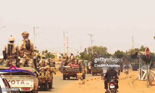 French troops, under escort from Niger forces, withdraw from Niamey, Niger on October 10 after an order of the Niger's military rulers.