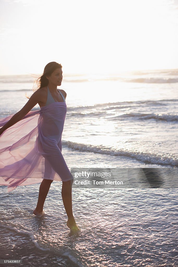 Woman walking on beach