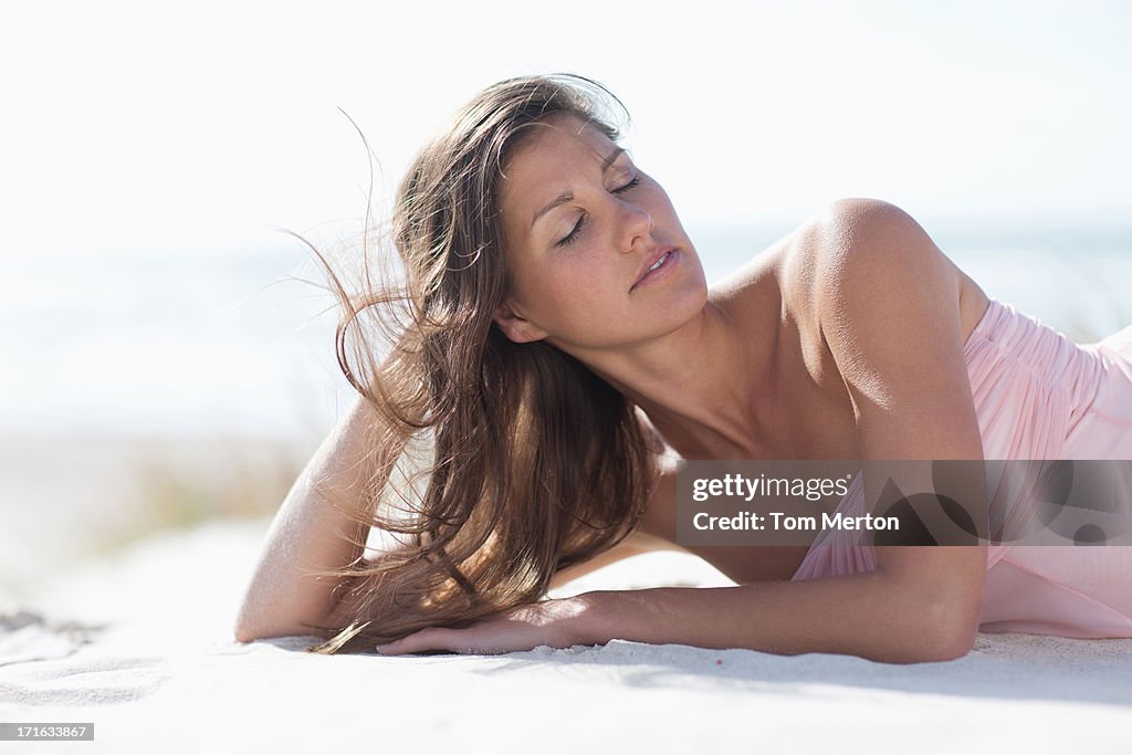 Woman laying on beach