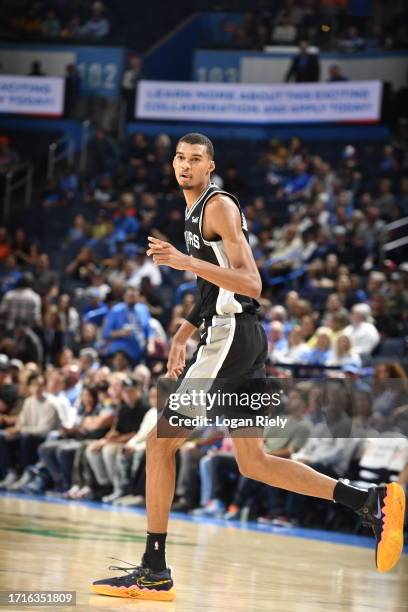 Victor Wembanyama of the San Antonio Spurs looks on during the game against the Oklahoma City Thunder on October 9, 2023 at the Paycom Center in...