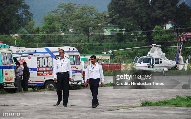 Pilots coming out of the Helicopter after landing at Doon Helidrome on June 27, 2013 in Dehradun, India. Air rescue operations resumed today to pull...