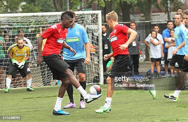 Soccer Players Sammy Ameobi and Stuart Holden attend The Sixth Edition Steve Nash Foundation Showdown at Sarah D. Roosevelt Park on June 26, 2013 in...