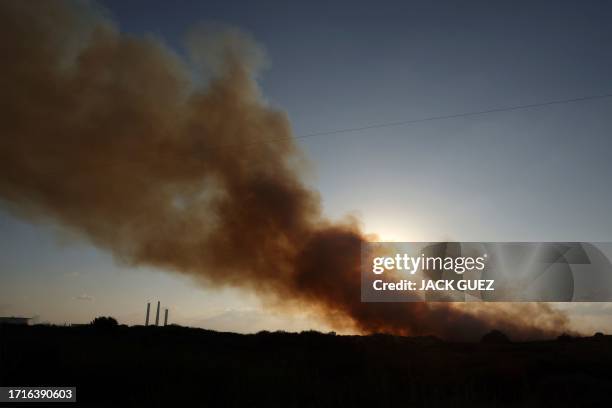 Smoke billows over the skies of the southern Israeli city of Ashkelon after a rocket attack from the Gaza Strip on October 10, 2023. Israel said it...