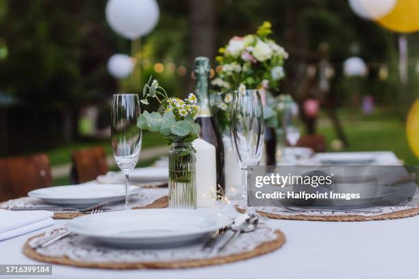 elegant table setting idea for summer outdoors dinner party. - place setting stock pictures, royalty-free photos & images