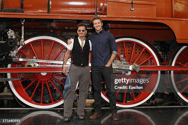 Actors Johnny Depp and Armie Hammer pose at a photocall before the Moscow Premiere of 'The Lone Ranger' on June 27, 2013 in Moscow, Russia.