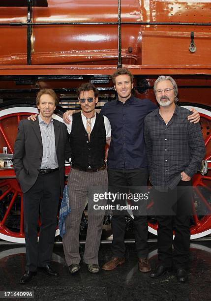 Executive producer Jerry Bruckheimer, actors Johnny Depp and Armie Hammer and director/producer Gore Verbinski pose at a photocall before the Moscow...