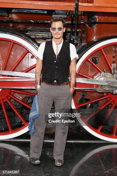 Actor Johnny Depp poses at a photocall before the Moscow Premiere of 'The Lone Ranger' on June 27, 2013 in Moscow, Russia.