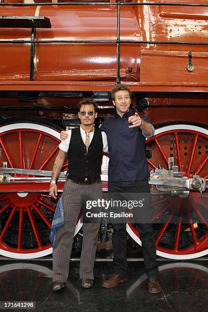 Actors Johnny Depp and Armie Hammer pose at a photocall before the Moscow Premiere of 'The Lone Ranger' on June 27, 2013 in Moscow, Russia.