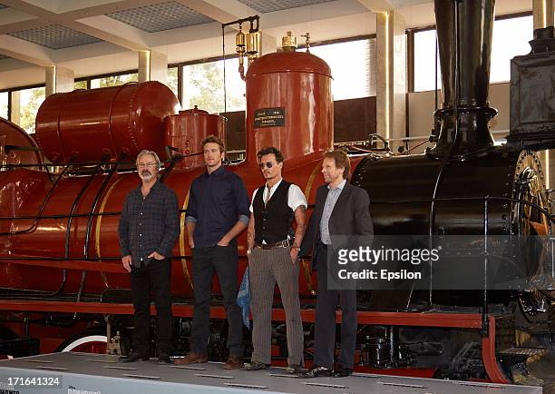 Director/producer Gore Verbinski, actors Johnny Depp, Armie Hammer and executive producer Jerry Bruckheimer pose at a photocall before the Moscow...