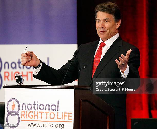 Texas Gov. Rick Perry speaks to the National Right to Life convention at the Hyatt Regency DFW International Airport Hotel June 27, 2013 in...