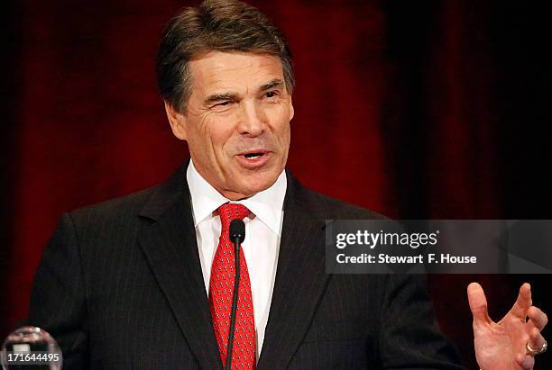 Texas Gov. Rick Perry speaks to the National Right to Life convention at the Hyatt Regency DFW International Airport Hotel June 27, 2013 in...