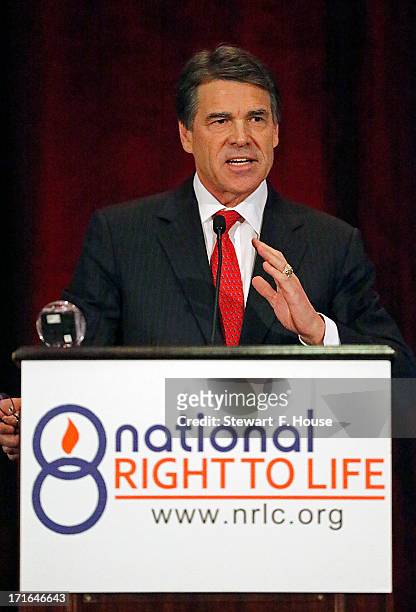 Texas Gov. Rick Perry speaks to the National Right to Life convention at the Hyatt Regency DFW International Airport Hotel June 27, 2013 in...