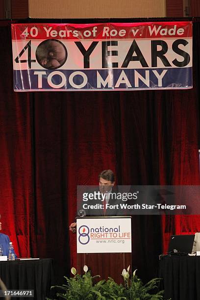 Gov. Rick Perry speaks during the general session of the 43rd annual National Right to Life Convention at the Hyatt Regency DFW International...